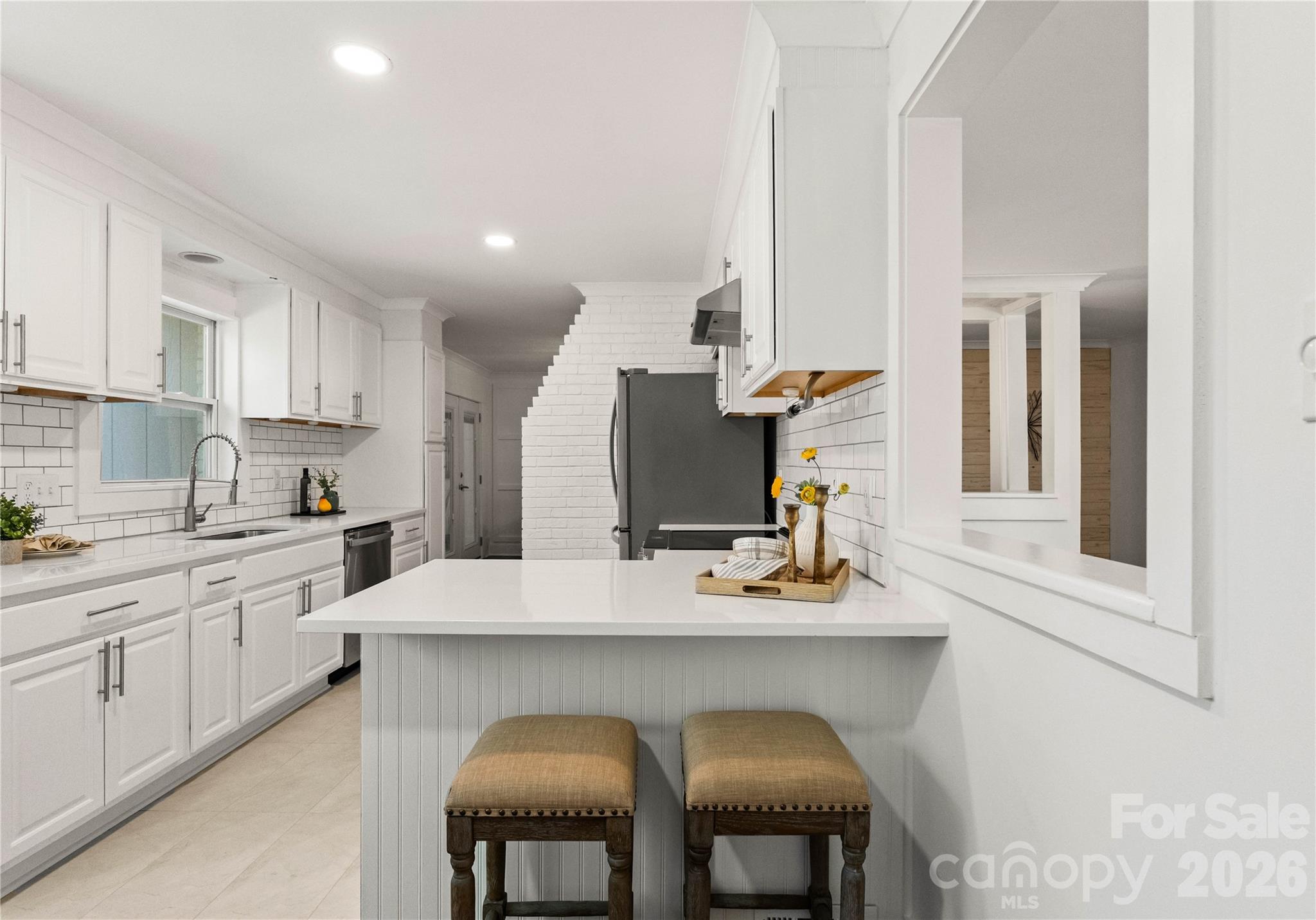 5100 White Oak Road Charlotte, NC 28210 - Photo 11 of 43 a kitchen with a sink cabinets and window