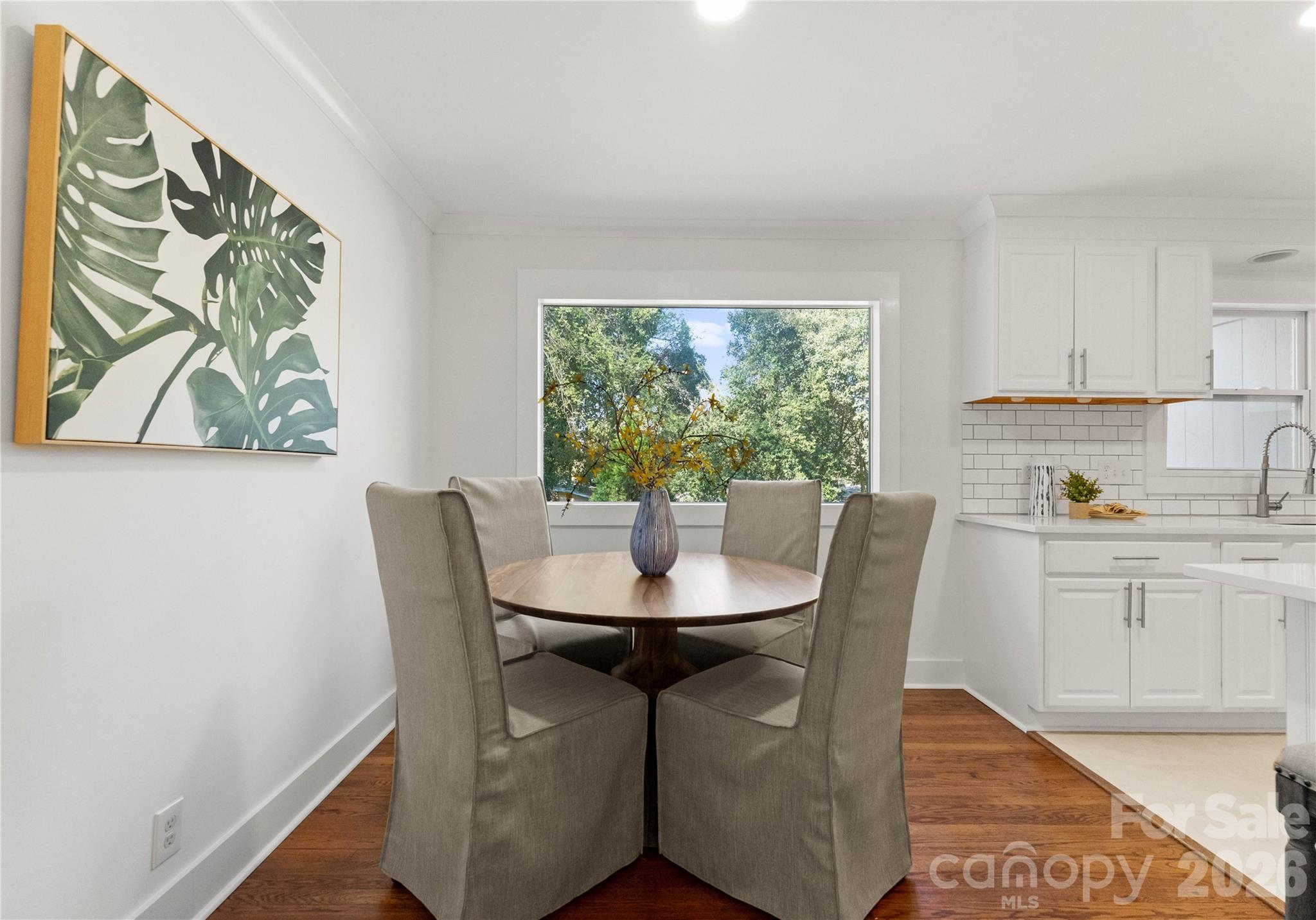 5100 White Oak Road Charlotte, NC 28210 - Photo 12 of 43 a dining room with furniture a window and wooden floor