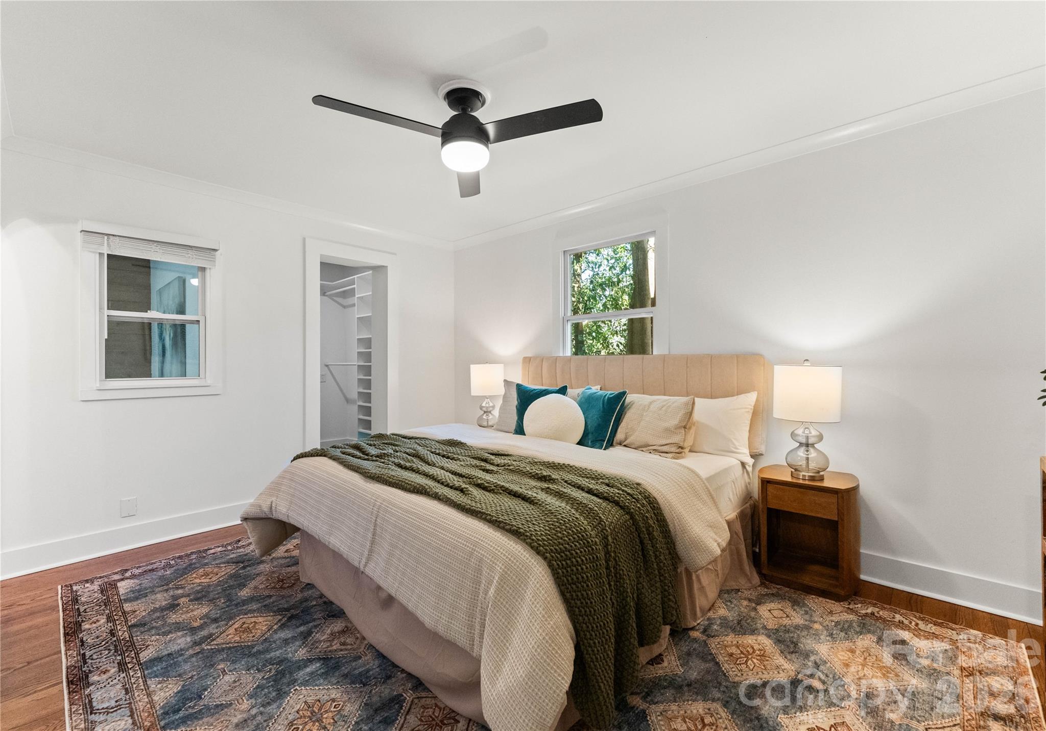 5100 White Oak Road Charlotte, NC 28210 - Photo 19 of 43 a bedroom with a bed and a ceiling fan