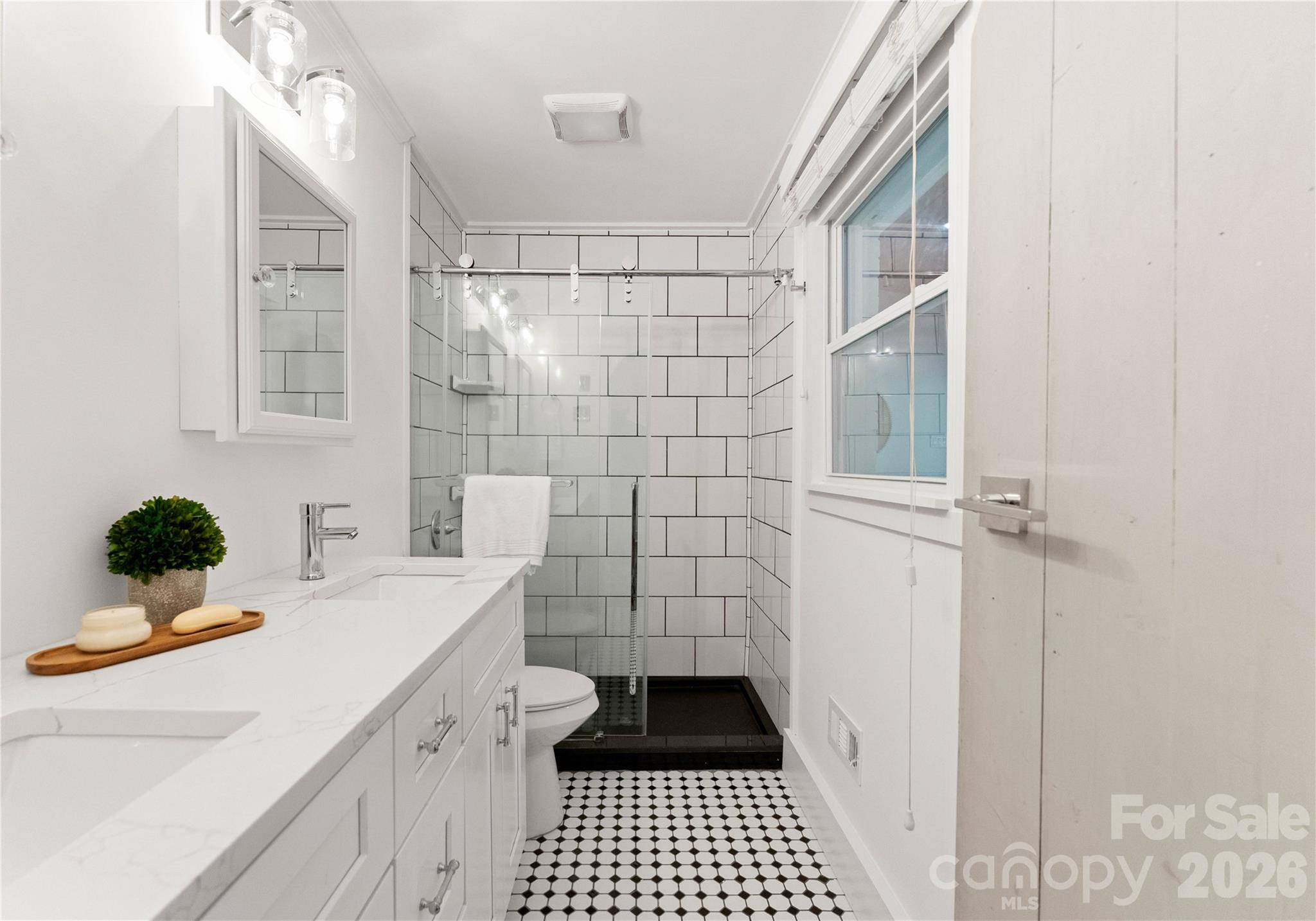 5100 White Oak Road Charlotte, NC 28210 - Photo 21 of 43 a bathroom with a sink a toilet and shower