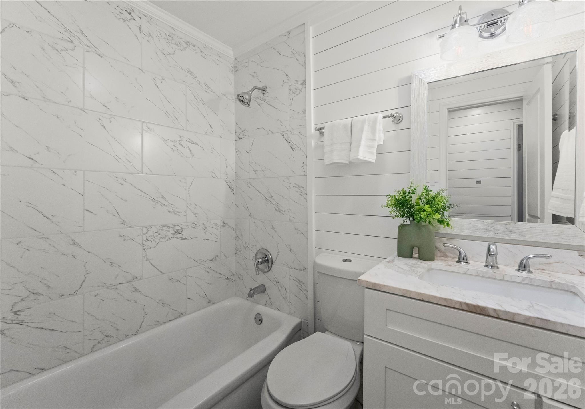 5100 White Oak Road Charlotte, NC 28210 - Photo 25 of 43 a bathroom with a granite countertop toilet a sink a mirror a bathtub and shower