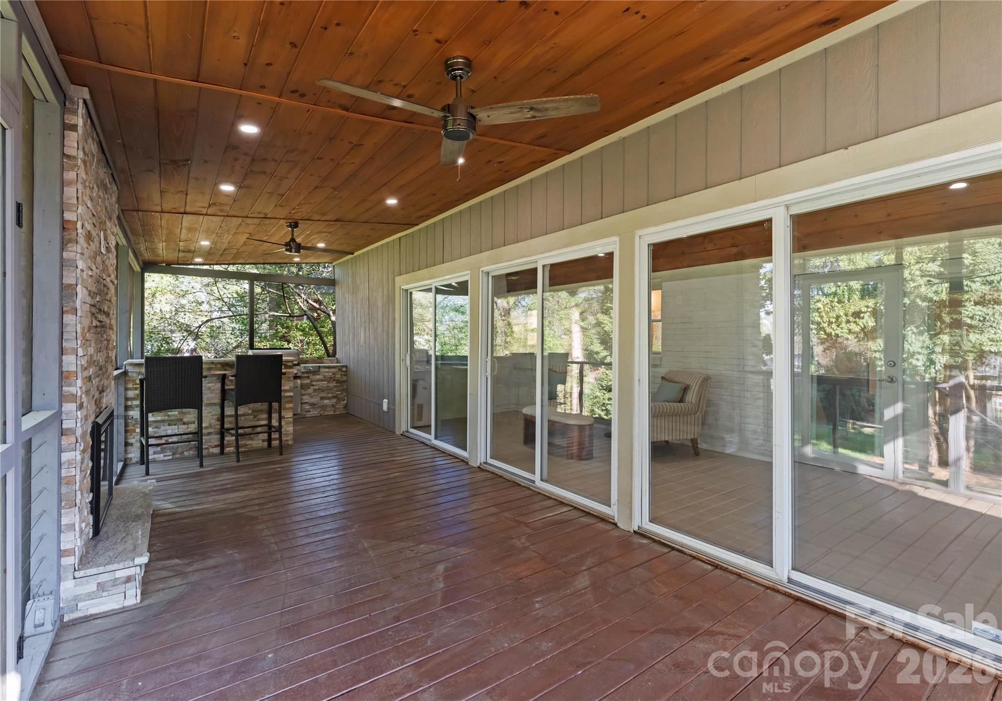 5100 White Oak Road Charlotte, NC 28210 - Photo 30 of 43 a view of a big room with wooden floor and floor to ceiling window