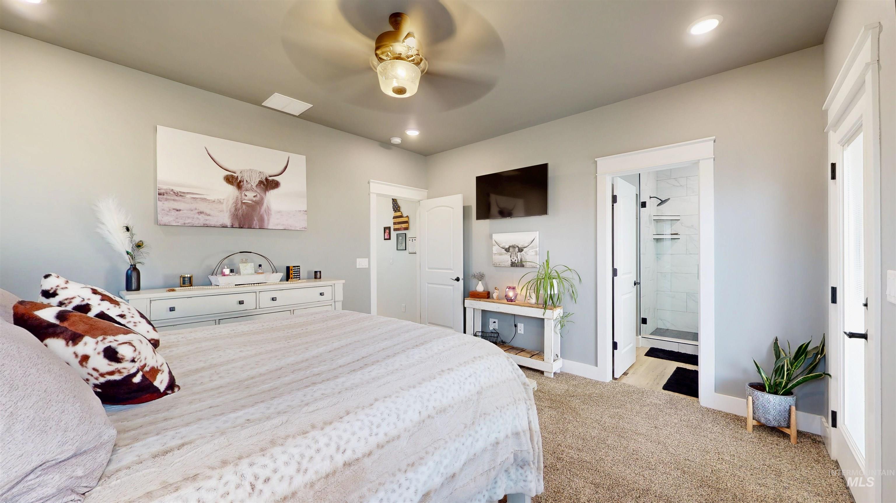 946 Kenbrook Loop Twin Falls, ID 83301 - Photo 13 of 35 Bedroom with light carpet, recessed lighting, ceiling fan, and ensuite bathroom