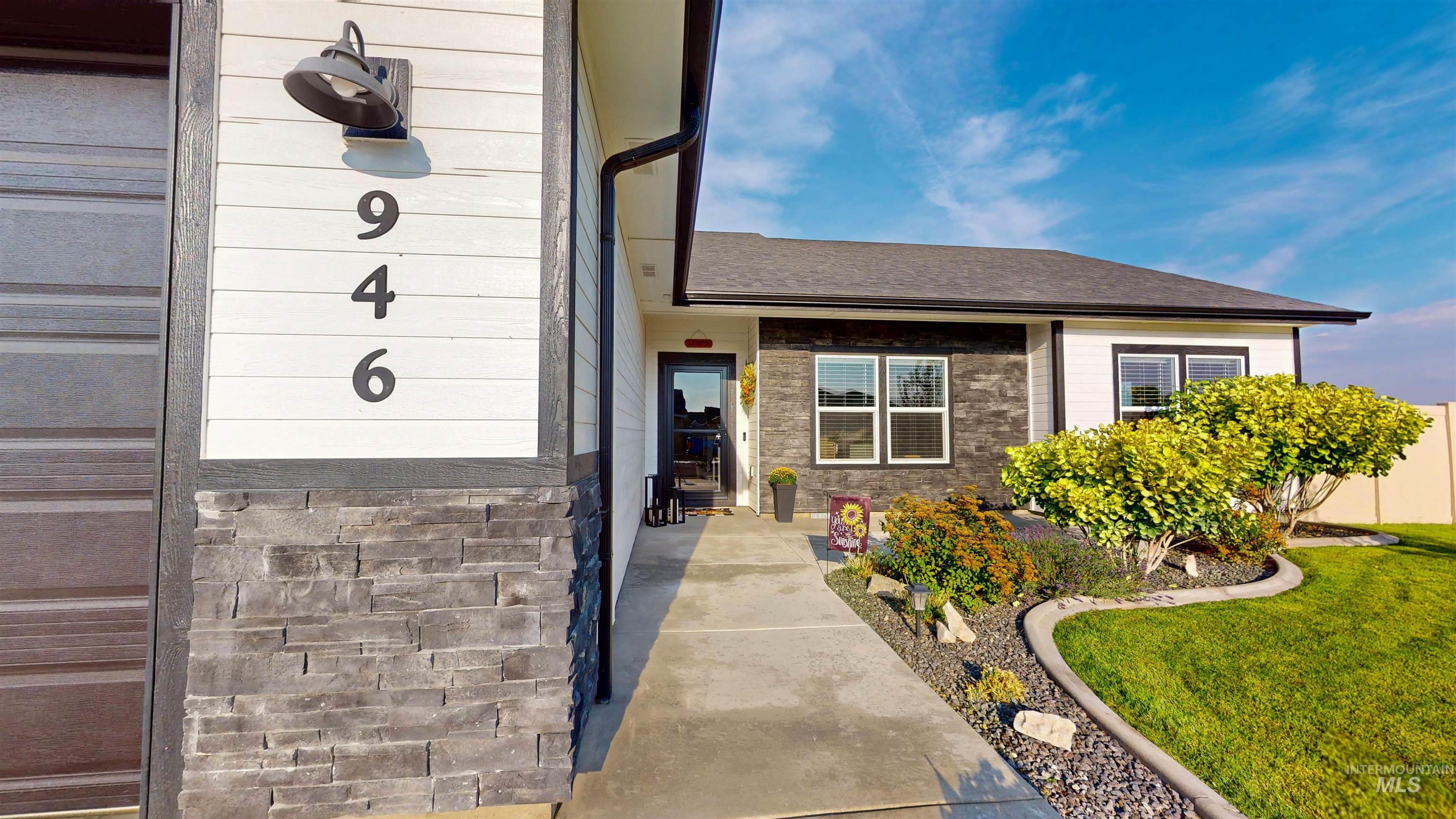 946 Kenbrook Loop Twin Falls, ID 83301 - Photo 2 of 35 Doorway to property with a yard and a shingled roof