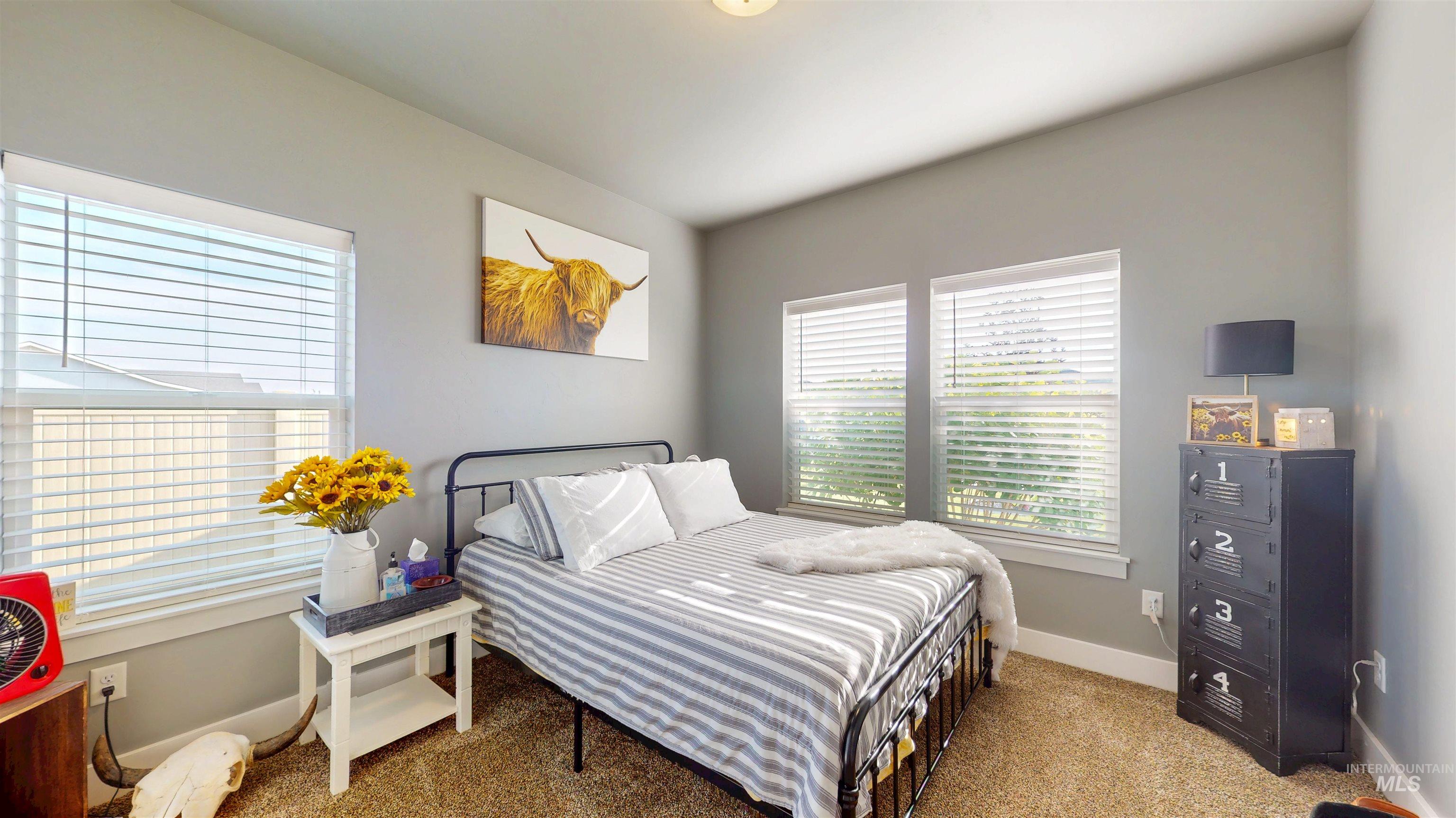 946 Kenbrook Loop Twin Falls, ID 83301 - Photo 8 of 35 Bedroom featuring carpet and multiple windows