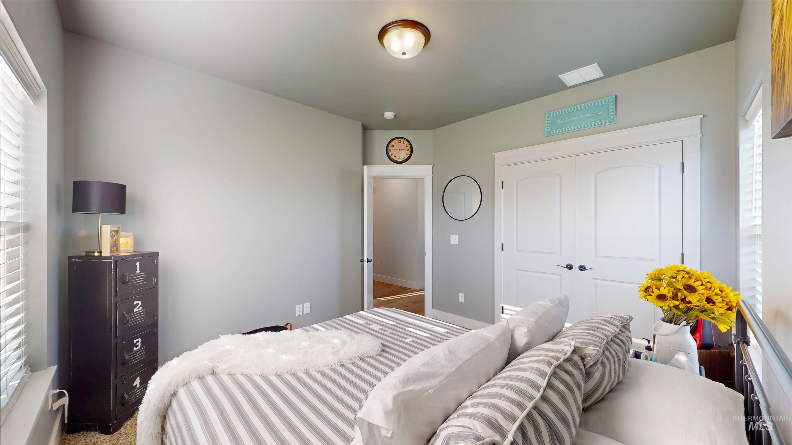 946 Kenbrook Loop Twin Falls, ID 83301 - Photo 9 of 35 Bedroom featuring multiple windows and a closet