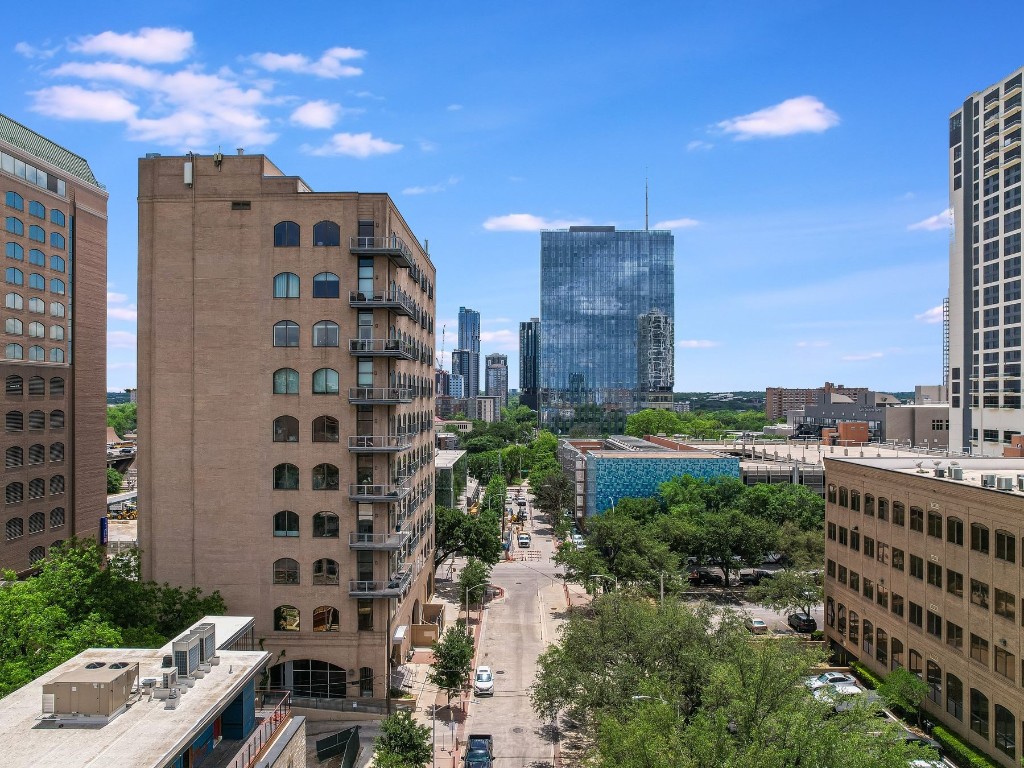 507 Sabine Street, Unit 303 Austin, TX 78701 - Photo 24 of 28 a city view with tall buildings and a street