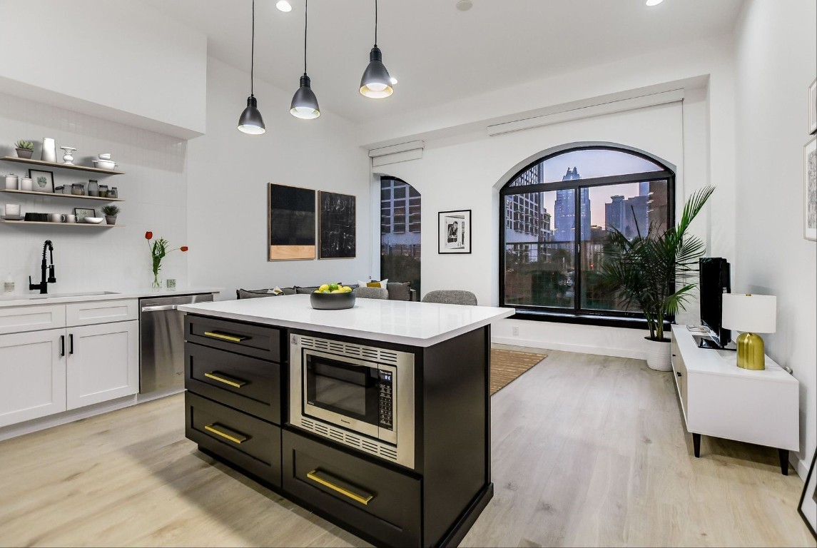507 Sabine Street, Unit 303 Austin, TX 78701 - Photo 7 of 28 a view of living room with washer and dryer