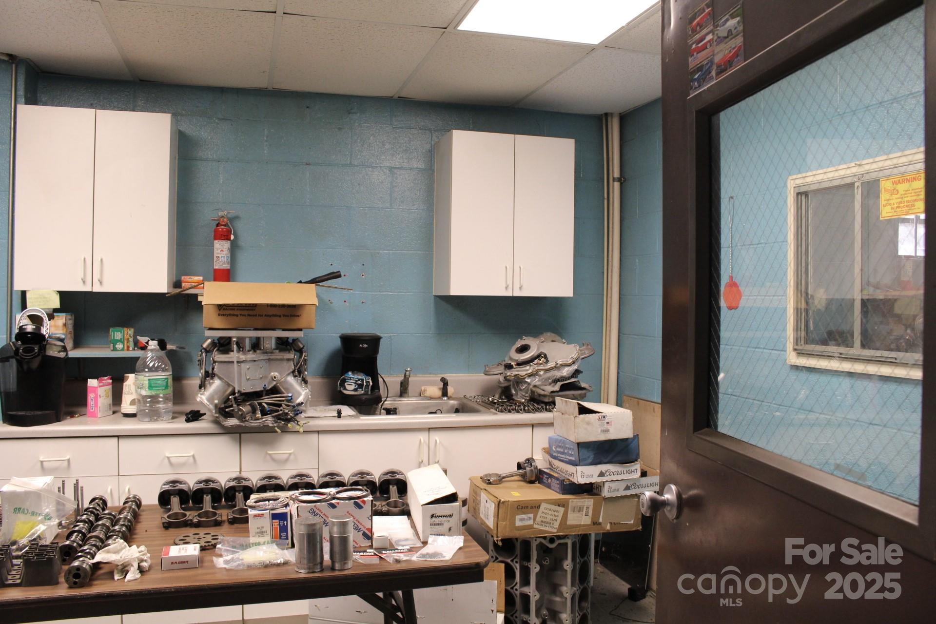 994 Rhyne Road Clover, SC 29710 - Photo 26 of 46 a kitchen with a dining table chairs and cabinets