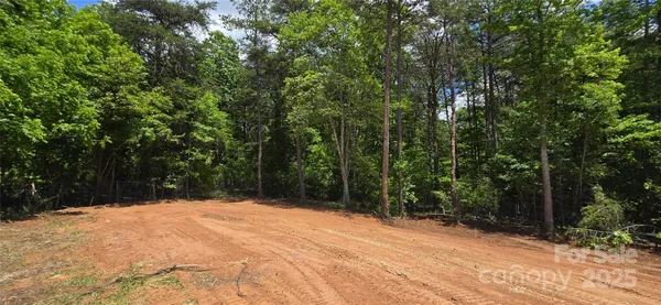 a view of a backyard of the house