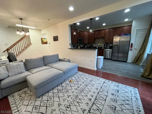 a view of a livingroom with furniture and a fireplace