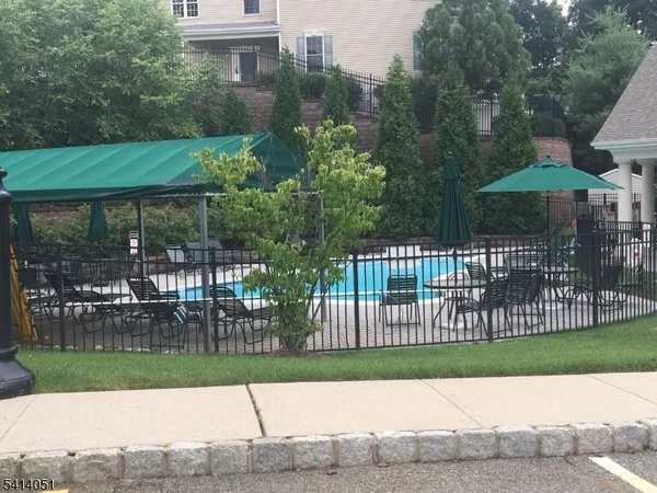 a view of a bedroom with washer and dryer