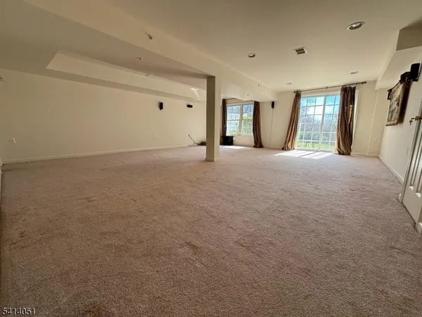 a room with gym equipment and a large mirror