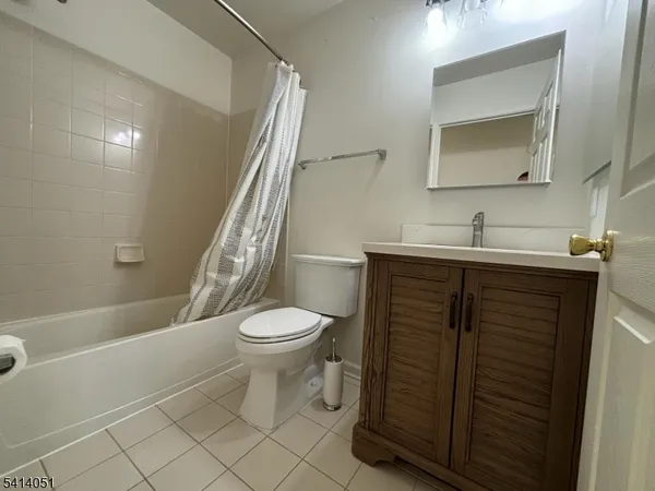 a city street lined with buildings and cars