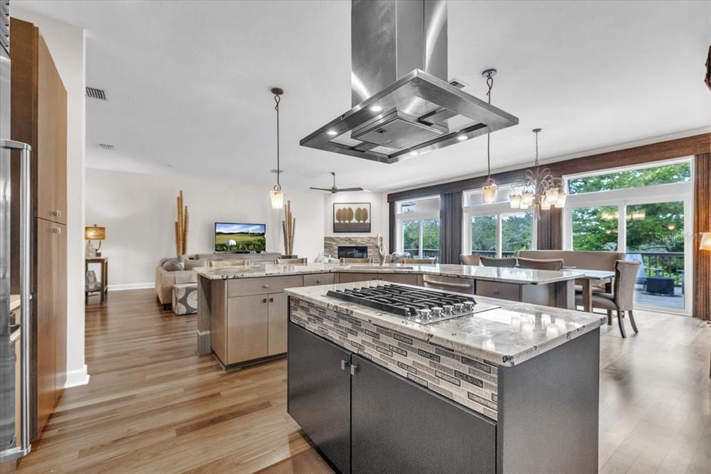 3850 Acline Road Punta Gorda, FL 33950 - Photo 11 of 50 a kitchen with a stove a counter space a sink and living room view