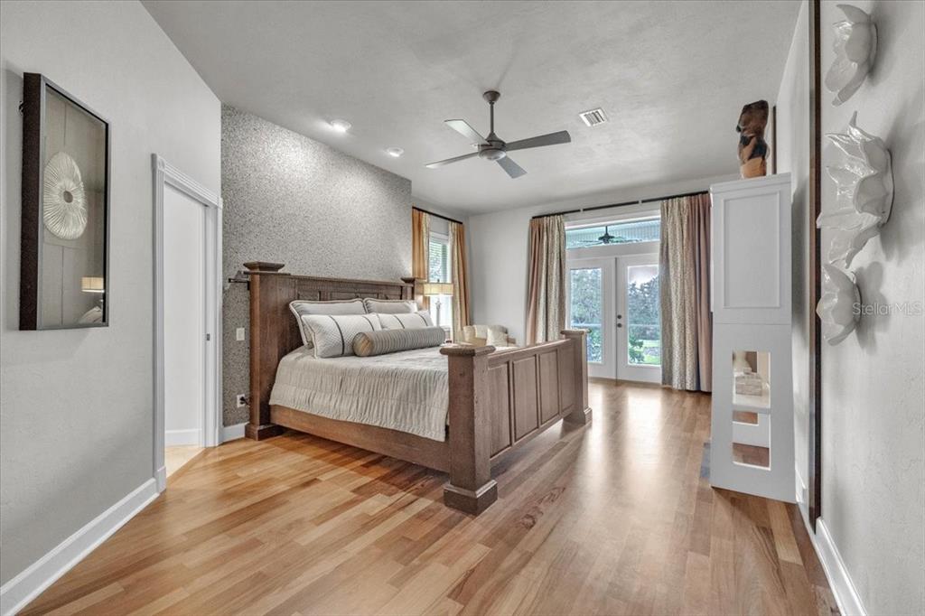 3850 Acline Road Punta Gorda, FL 33950 - Photo 17 of 50 a bedroom with a bed and wooden floor