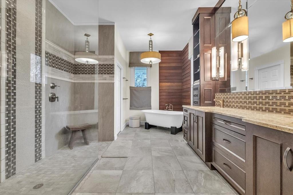 3850 Acline Road Punta Gorda, FL 33950 - Photo 19 of 50 a bathroom with a double vanity sink a toilet and shower