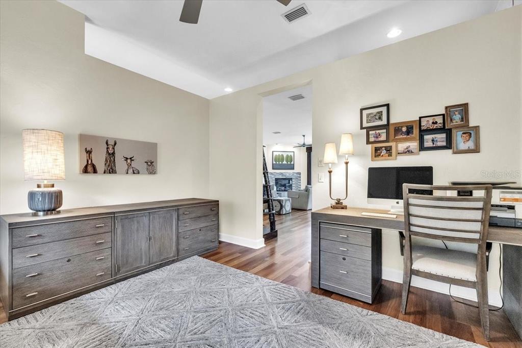 3850 Acline Road Punta Gorda, FL 33950 - Photo 23 of 50 a spacious bedroom with a bed and a cabinets