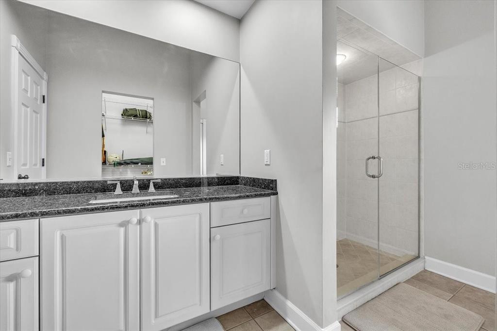3850 Acline Road Punta Gorda, FL 33950 - Photo 32 of 50 a bathroom with a granite countertop sink and a mirror