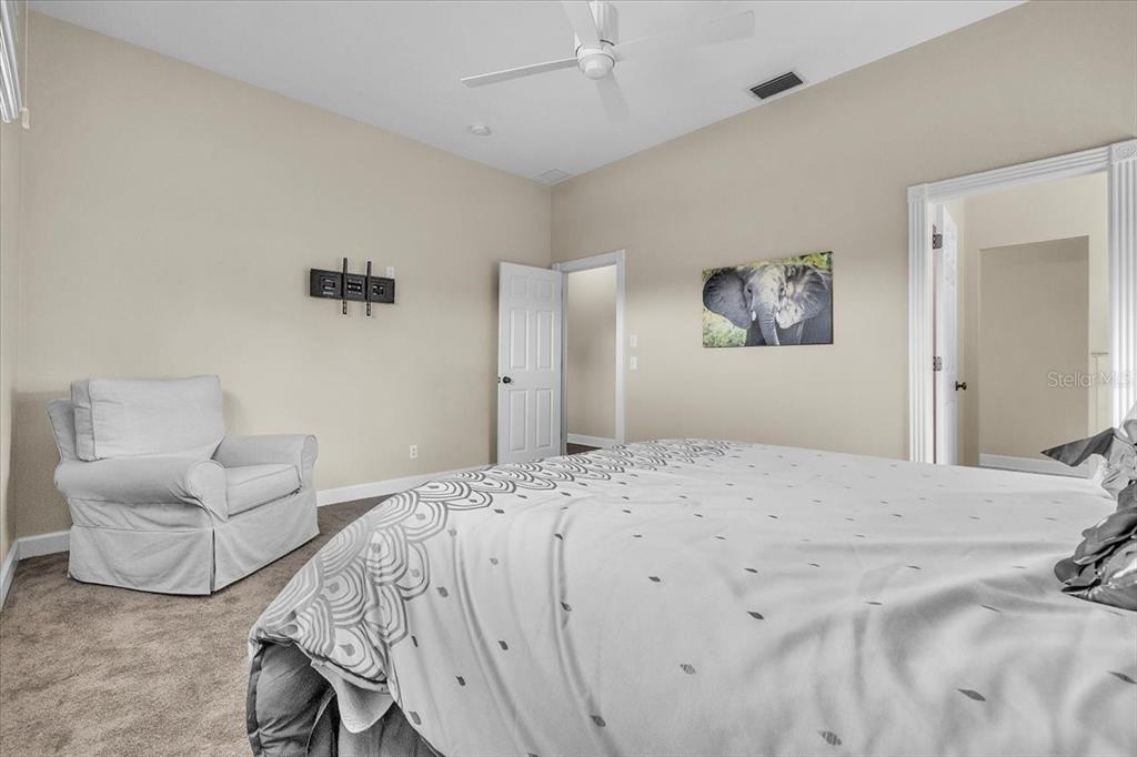 3850 Acline Road Punta Gorda, FL 33950 - Photo 34 of 50 a bedroom with a bed and a couch