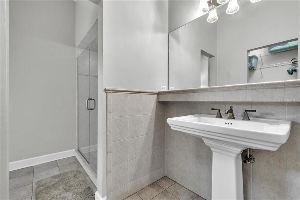 3850 Acline Road Punta Gorda, FL 33950 - Photo 35 of 50 a bathroom with a sink a mirror and shower