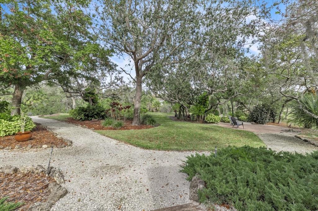 3850 Acline Road Punta Gorda, FL 33950 - Photo 44 of 50 a view of a yard with large trees