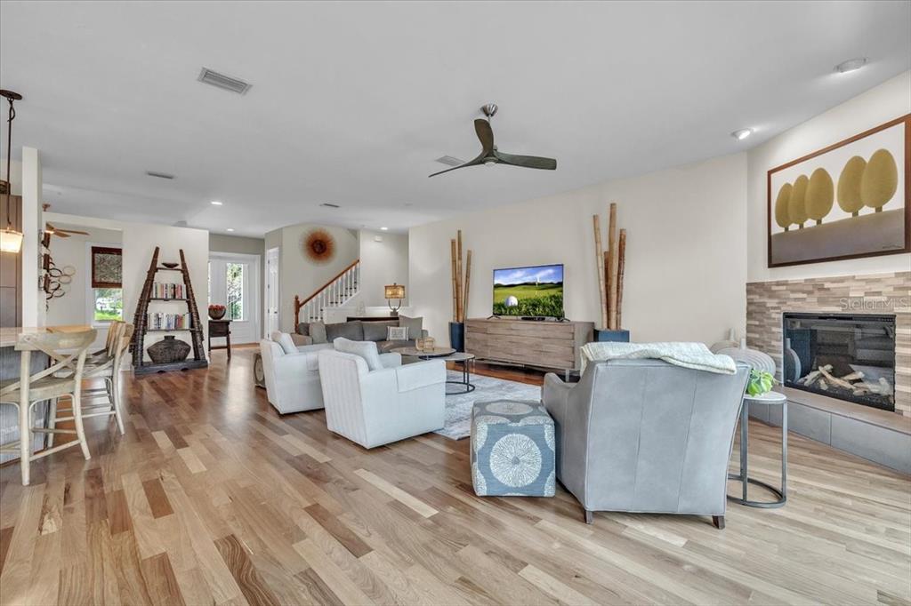 3850 Acline Road Punta Gorda, FL 33950 - Photo 8 of 50 a living room with furniture a fireplace and a flat screen tv