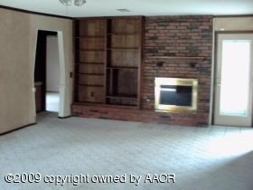 8310 Lamount Drive Amarillo, TX 79110 - Photo 2 of 6 a view of an empty room with a fireplace
