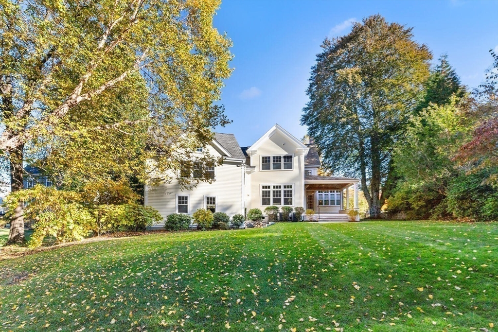 209 Waltham Street Lexington, MA 02421 - Photo 2 of 39 a front view of a house with garden