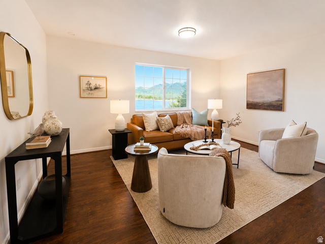 30 West 7500th Street South, Unit 18 Midvale, UT 84047 - Photo 6 of 14 Hardwood-finish flooring throughout the room with white baseboards and neutral wall paint