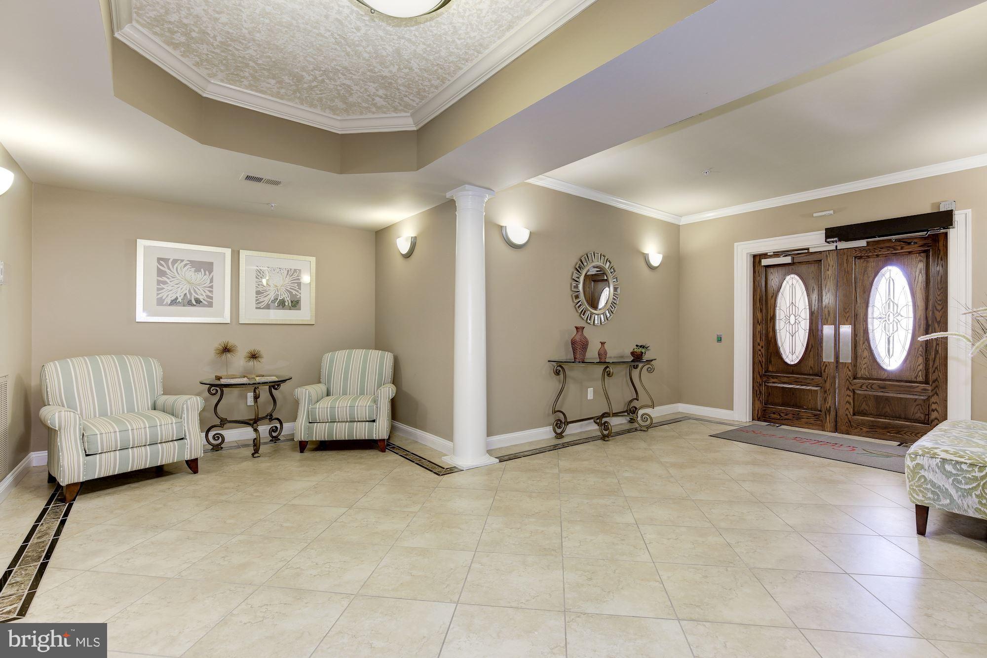 7305 Brookview Road, Unit 304 Elkridge, MD 21075 - Photo 4 of 45 Secure Elevator Building w/ Spacious Entry Lobby