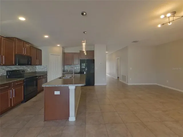 a view of room with window and hardwood floor