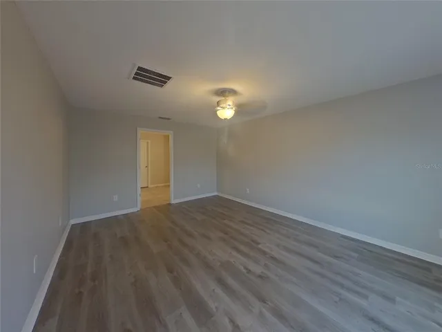 a bathroom with a granite countertop sink a mirror and a