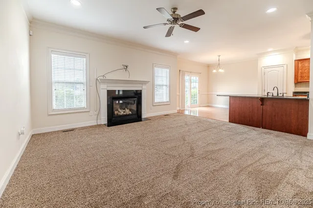 a large room with a fireplace and window