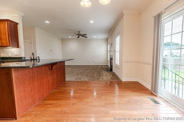 a view of a kitchen with a sink and a window