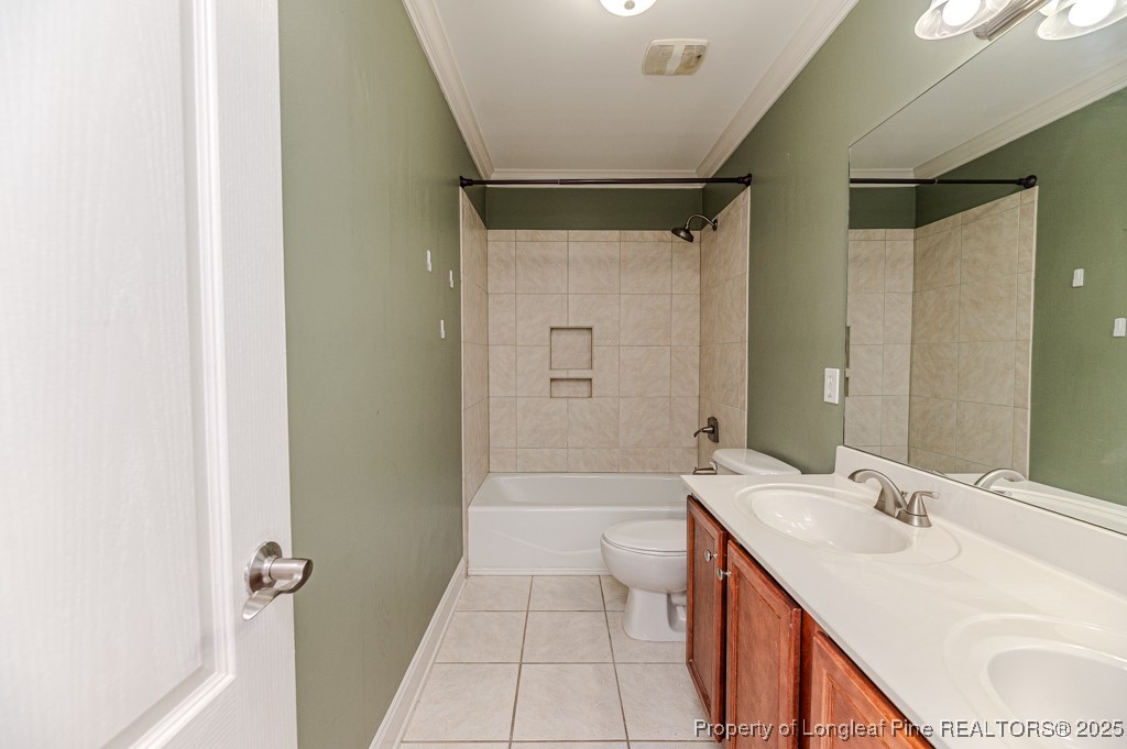2636 Plum Ridge Road Fayetteville, NC 28306 - Photo 34 of 48 a bathroom with a sink a toilet and shower