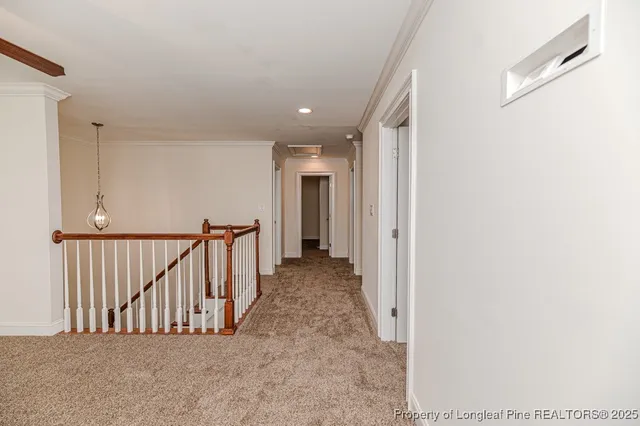 a view of a livingroom with a ceiling fan and window