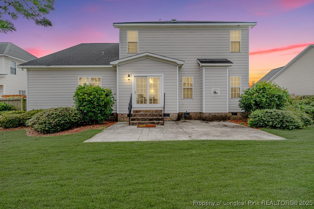 2636 Plum Ridge Road Fayetteville, NC 28306 - Photo 48 of 48 a front view of a house with a yard and garage