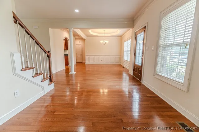 a view of an entryway with wooden floor