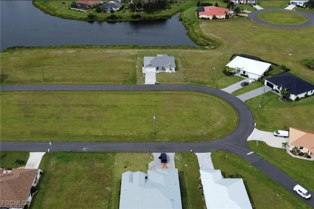 an aerial view of a house with a lake view