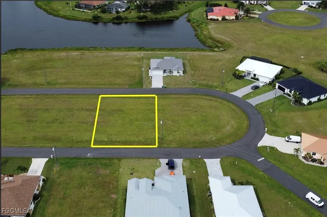 an aerial view of a house with a garden and swimming pool