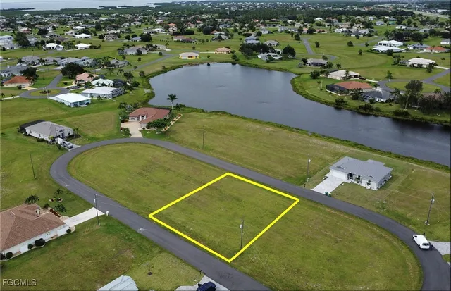 an aerial view of a pool yard residential house and outdoor space
