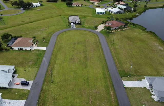an aerial view of a golf course with chairs