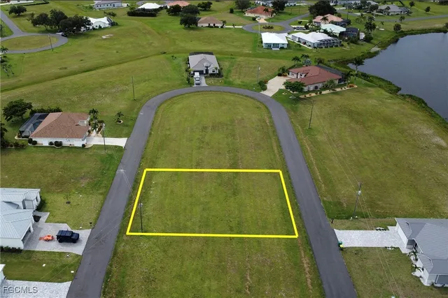 an aerial view of a residential houses with outdoor space