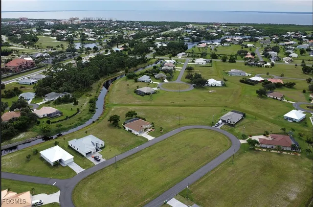 an aerial view of a residential houses with outdoor space