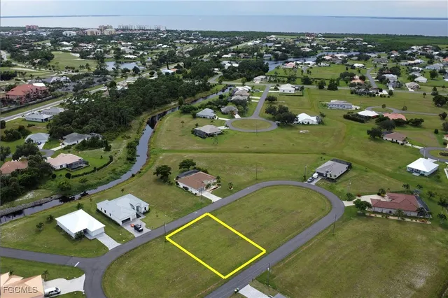 an aerial view of a residential houses with outdoor space