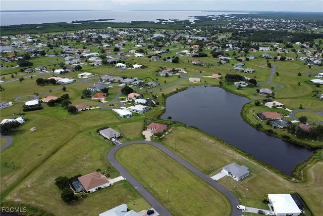 swimming pool view with a garden view