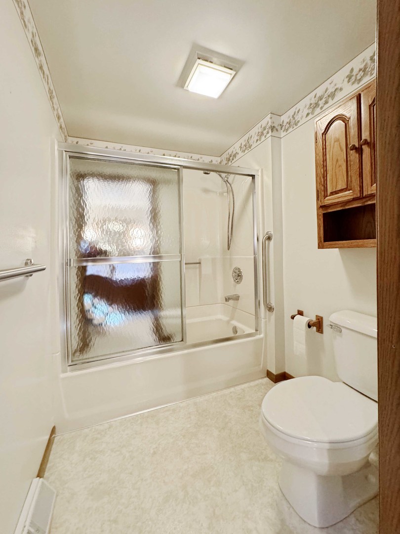 14231 West Kent Road Kent, IL 61044 - Photo 23 of 29 a bathroom with a toilet and a shower