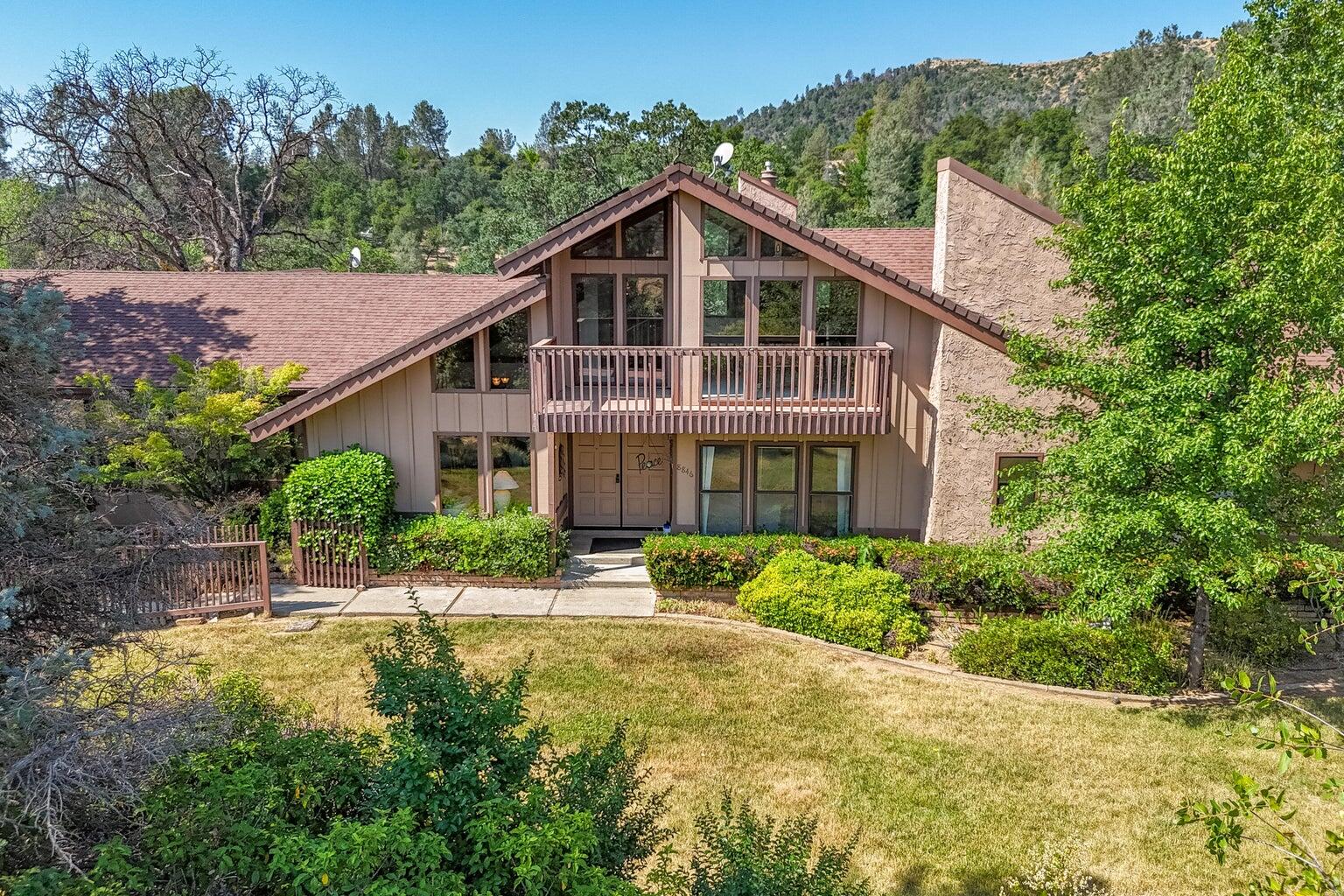 8846 Goldstone Lane Redding, CA 96001 - Photo 61 of 64 a front view of a house with a yard