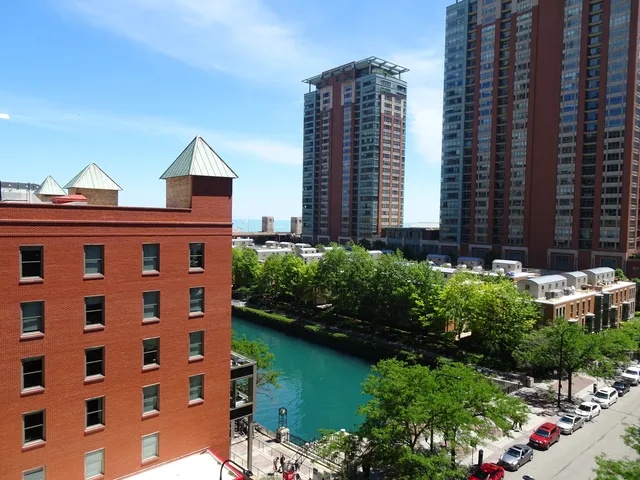 a bedroom with bed and a mirror